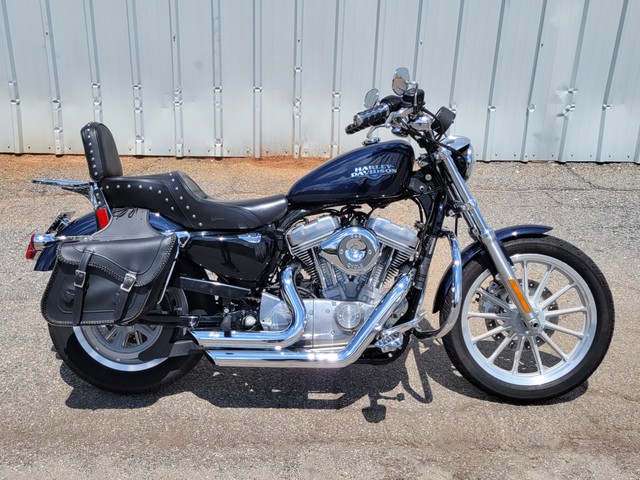 2009 Harley Davidson
Sportster XL883L
Dark Blue Pearl with 8,210 miles
Equipped with 1200cc kit, 5-speed transmission, forward controls, Vance & Hines exhaust, Saddleman seat, saddlebags, passenger backrest with luggage rack and more!  Financing and warranty are available.
Hawg Pen Price $4,995.00
